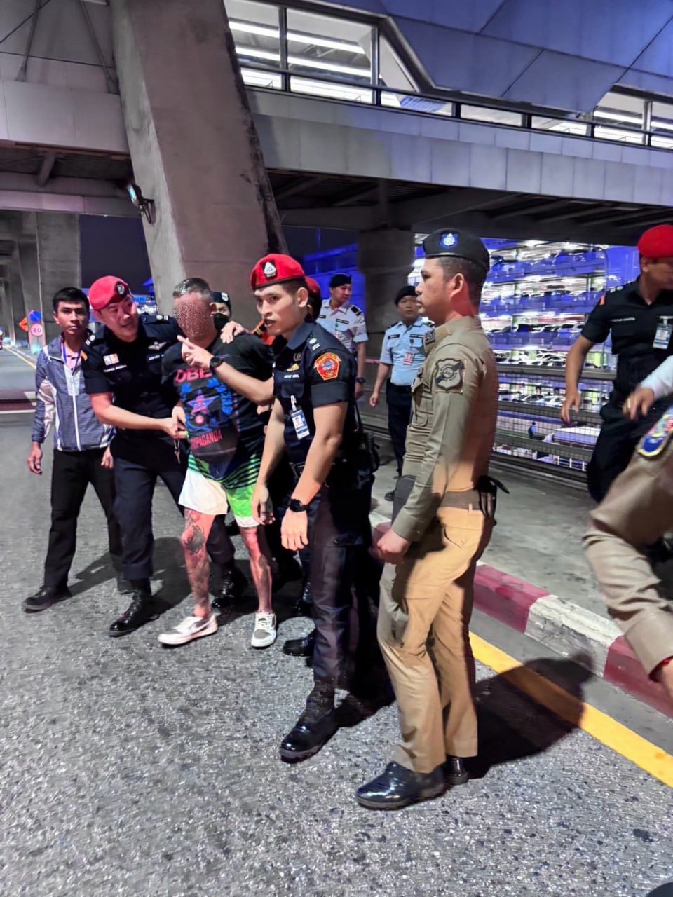 A Russian citizen was detained at Bangkok airport amid life-threatening behavior.
